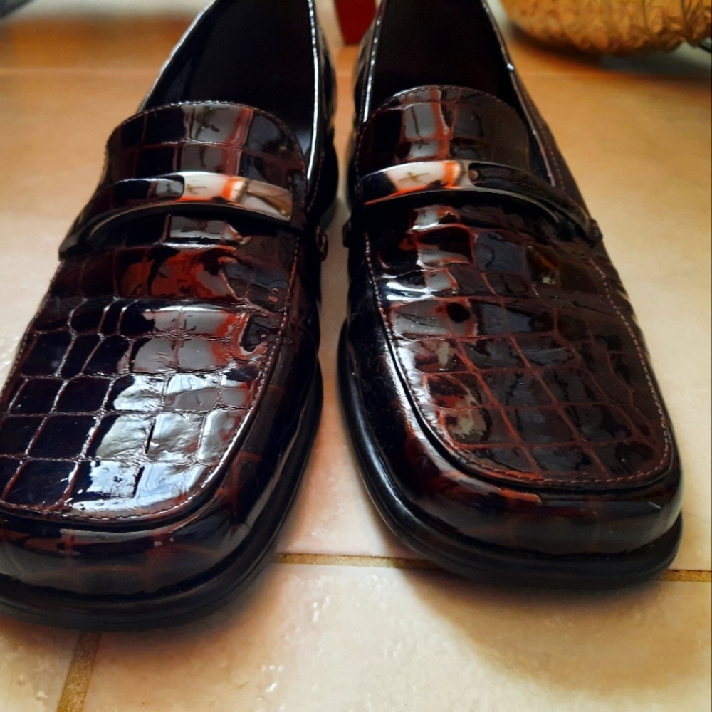 Patent leather brown shoes.